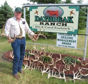 Jim Faulstich with ranch sign.