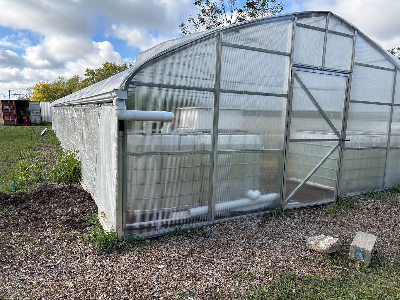 A greenhouse full of water tanks